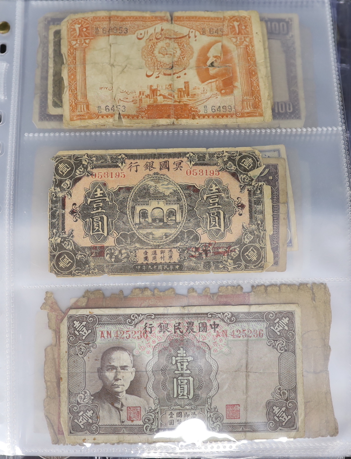 A collection of British Commonwealth and World coins together with 19th/20th century banknotes including China